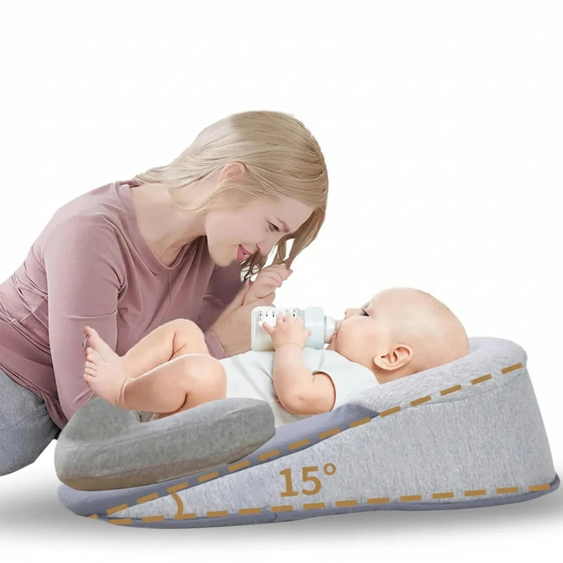Gray U-shaped baby nursing and feeding pillow with a 15-degree anti-reflux incline, supporting a baby bottle-feeding.