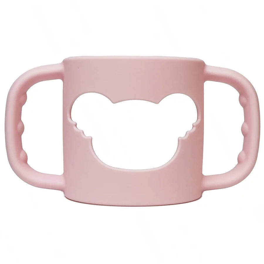 Soft pink silicone baby bottle handle with a bear-shaped cutout, designed for easy grip.